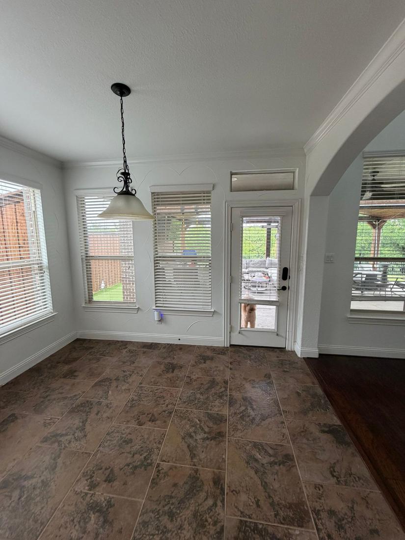 Breakfast nook before with standard back door and windows
